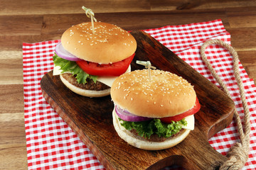 Delicious fresh homemade burger on a wooden table