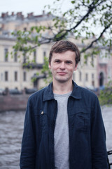 Portrait of young man in St. Petersburg city.
