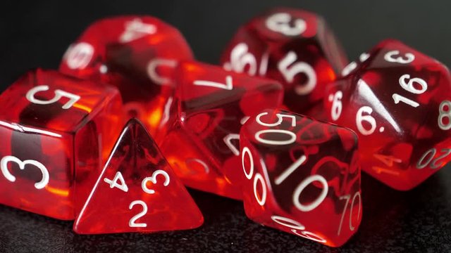 focus pull close up on red tabletop gaming dice