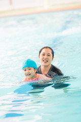 Fototapeta premium kid and parent swimming together