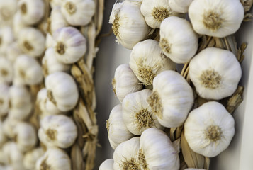 Strings of dried garlic in a traditional market