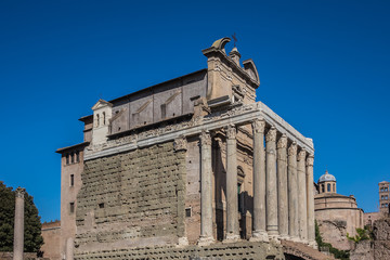Fototapeta na wymiar One of the most famous landmarks in the world - Roman Forum :Temple of Antoninus and Faustina, 141 AD. Rome, Italy.