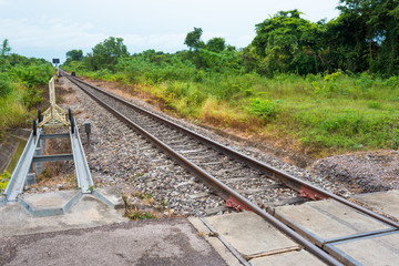 Railway. Crossing point between  railroad and public road in country side of Thailand.