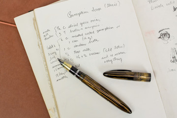 Close-up of fountain pen on a recipe for pumpkin soup for fall
