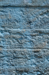 Obraz premium Rough grunge concrete surface painted in blue closeup as background