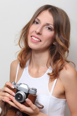 Fototapeta premium photographer holding a film camera in hands