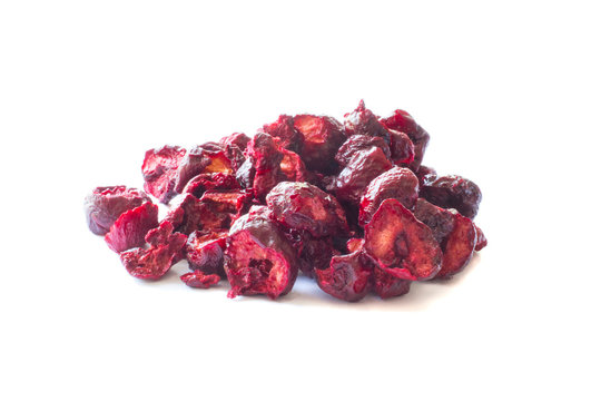 Freeze dried anf fresh cherry on a white background.