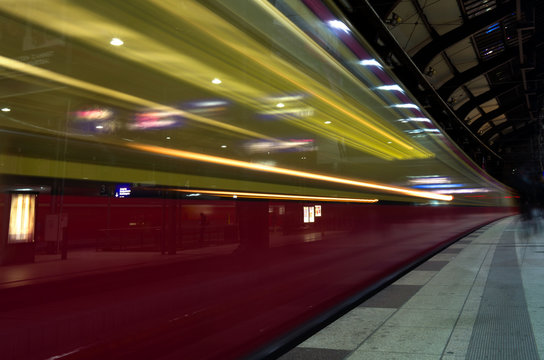 Train is rapidly passing the platform in Berlin Germany ling exposure motion blur
