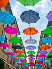 Fototapeta na wymiar The umbrellas of Pietrasanta town in Italy. Street view July 2017.