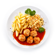 Meatballs with french fries and vegetables