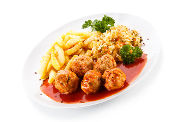 Meatballs with french fries and vegetables