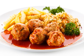 Meatballs with french fries and vegetables