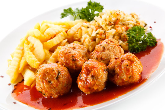 Meatballs with french fries and vegetables