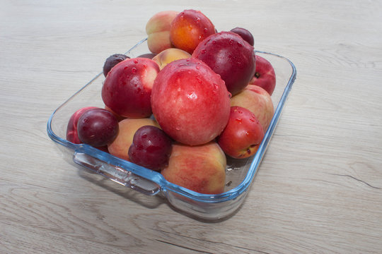 Juicy peaches, nectarine and plums on the kitchen table. fruit on the table