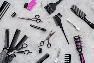 Beauty saloon. Haidressing tools on grey table background top view