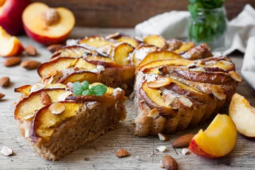 Foto op Canvas Pie with peaches and almonds © yuliiaholovchenko