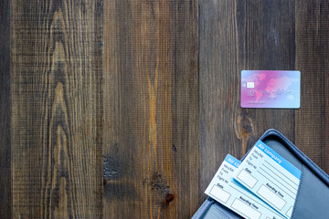 Buy tickets for travel. Tickets on wooden table background top view copyspace