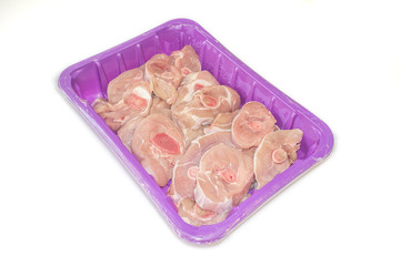 Fresh turkey chops thigh on a foam meat tray