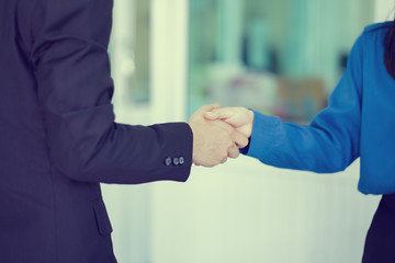 close up businessman handshake with partner,ceo leader hand shake for agreement or approve or deal...