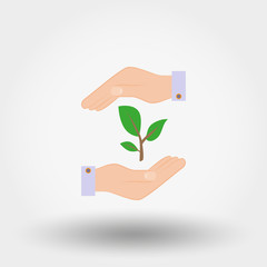 Green twig in a hand. Sign of environmental protection.