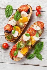 Bruschetta with tomatoes, mozzarella and basil