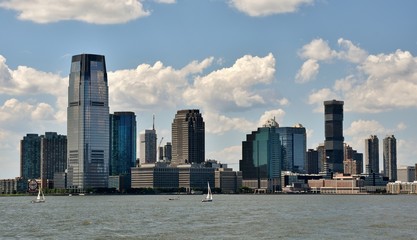 Naklejka premium The skyline of Jersey City, New Jersey across the Hudson River