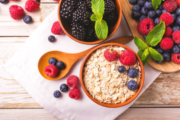 Raspberry, blueberry with mint and oatmeal breakfast or smoothie.