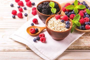 Raspberry, blueberry with mint and oatmeal breakfast or smoothie.