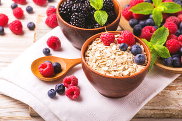 Raspberry, blueberry with mint and oatmeal breakfast or smoothie.