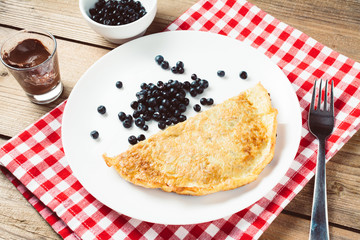 omelette with fruit and oat. top view