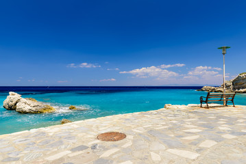 Fototapeta na wymiar The picturesque coastline and blue sea, Kokkari village, Samos island, Greece