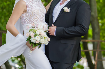 Beautiful bride with bouquet before wedding ceremony
