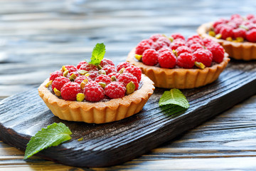 Tartlets with chocolate,raspberry and pistachio.