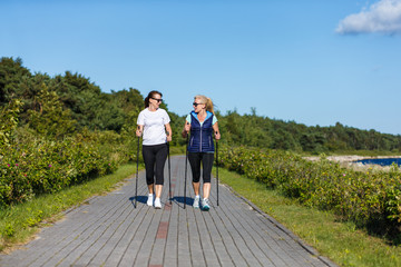 Nordic walking - active people working out in park