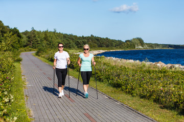Nordic walking - active people working out in park