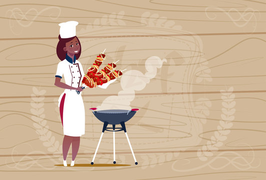 Female African American Chef Cook Holding Kebab Cartoon Chief In Restaurant Uniform Over Wooden Textured Background Flat Vector Illustration