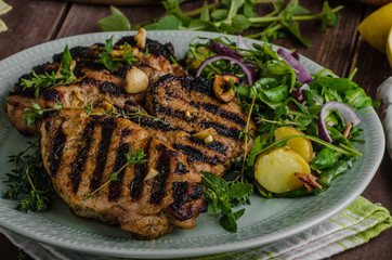 Grilled pork chops with lettuce salad