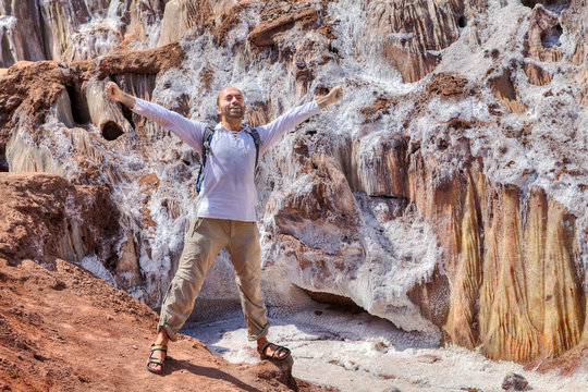Traveler is happy about his journey, Hormuz Island, Iran.