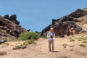 Photographer traveler walking in Hormoz Island, Hormozgan Province, southern Iran.