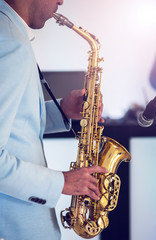 Obraz na płótnie Canvas A man with saxophone