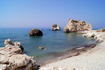 Fototapeta na wymiar Aphrodite Bay. Beautiful beach located next to the Rock of the Greek, the birthplace of the goddess Aphrodite, Cyprus.
