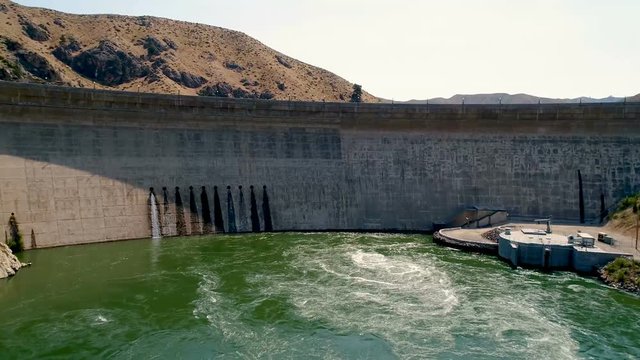 Water bubbles from below a dam in Idaho in summer