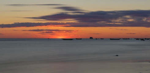 long exposure landscape image of sea during  sunset