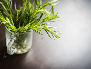 Bunch Rosemary in glass on table