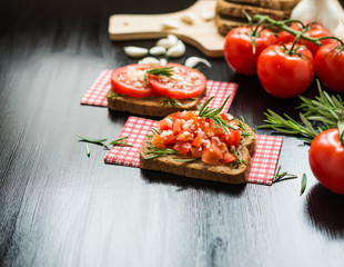 Healthy Food. Vegetarian food. Sandwiches with vegetables. Italian Bruschetta. Bread with chopped tomatoes, garlic, rosemary
