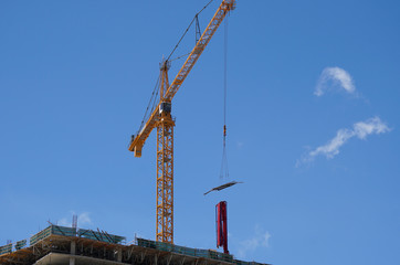 Working Crane Against a Brilliant Blue Sky