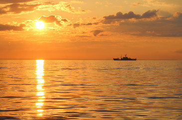Fototapeta na wymiar Battleship at sunset