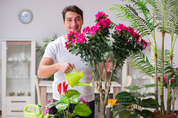 Young man in gardening concept at home