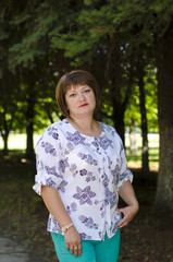 Fototapeta premium A woman of Slavic appearance poses against the background of oil.