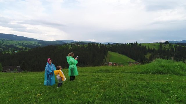Family wearing raincoats